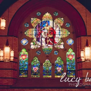 Tiffany Window of St. Martin of Tours giving his cloak to a beggar (Lucy Baber Photography) from St. Martin's webpage