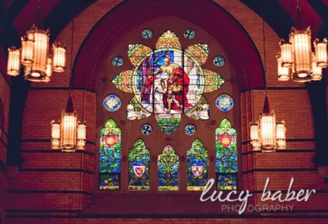 Tiffany Window of St. Martin of Tours giving his cloak to a beggar (Lucy Baber Photography) from St. Martin's webpage