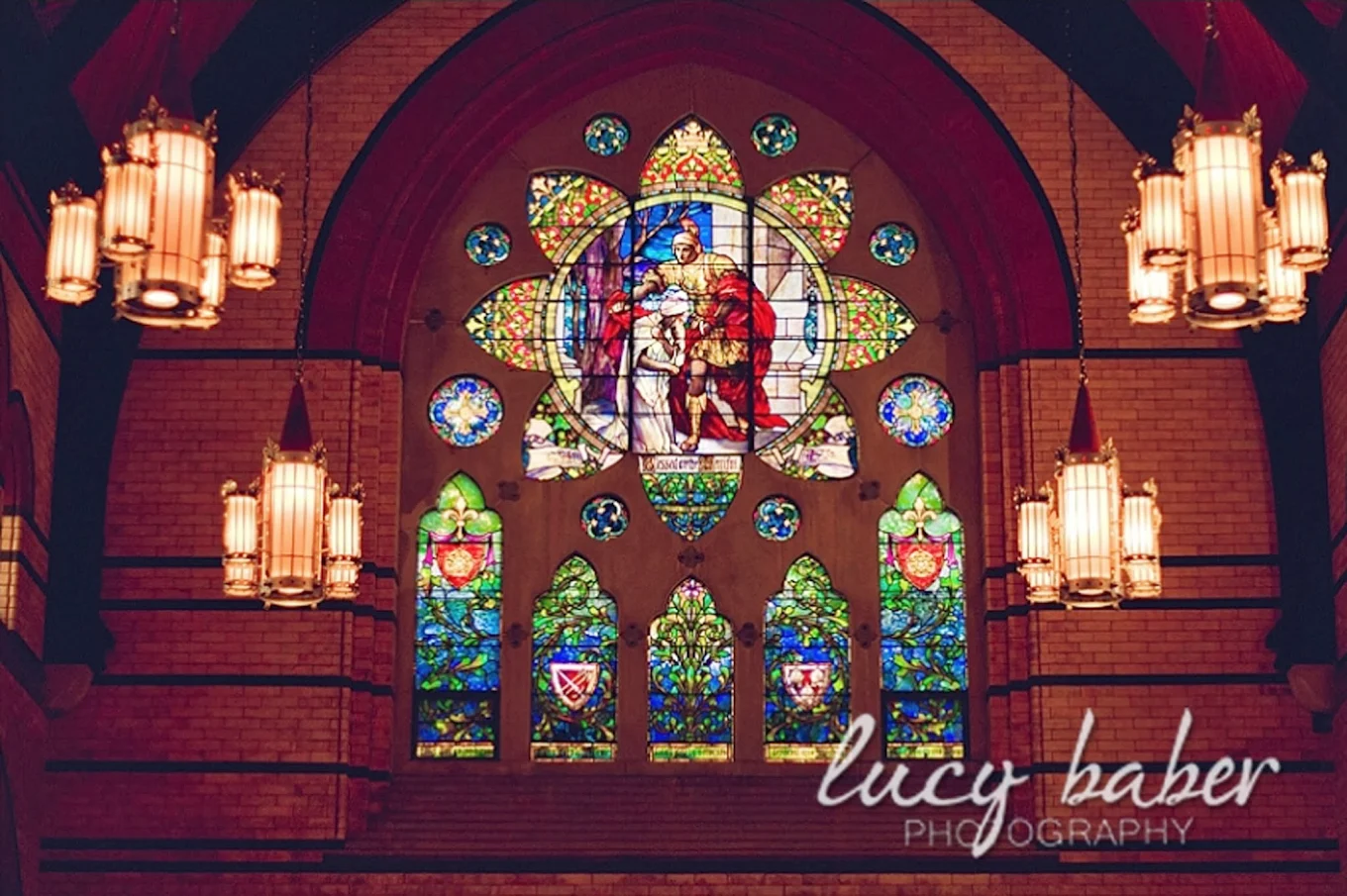 Tiffany Window of St. Martin of Tours giving his cloak to a beggar (Lucy Baber Photography) from St. Martin's webpage